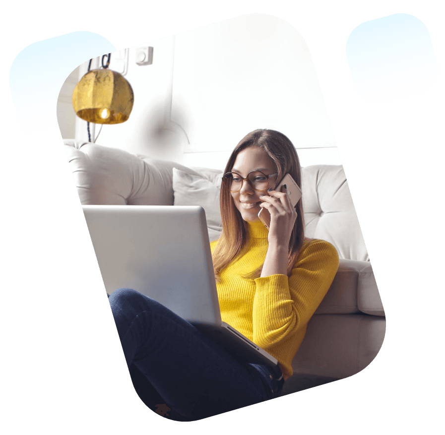 Woman talking on phone and using laptop